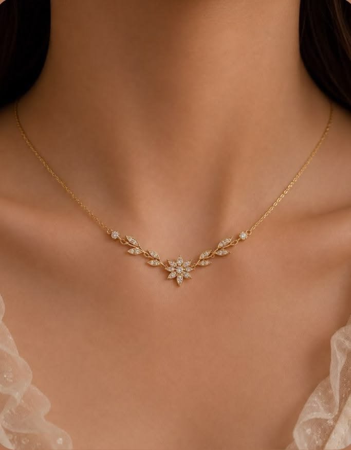 Aria gold necklace with floral leaf pendant design